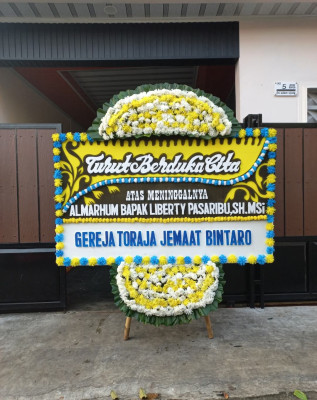 Papan Bunga Duka di Pelambuan